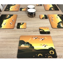 Dining table display with bowls of Plymouth placemats corkbacked Summer Gold design