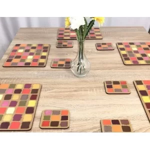 Dining table setting of all 6 square Harlequin coasters, corkbacked design by Plymouth