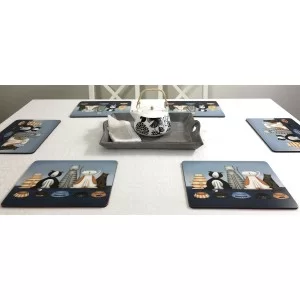 White tablecloth with animal design tablemats of five Hungry Cats, cork backed hard surface.
