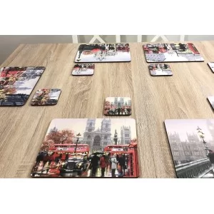 Wooden dining table with Streets of London corkbacked placemats by Plymouth Pottery