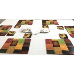 Majestic design of vibrantly coloured corkbacked placemats on dining table with white tablecloth