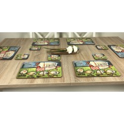 Wooden table with Plymouth Mother Hen drinks coasters