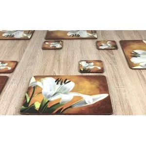 Lily Sunburst design cork backed floral coasters on wooden table