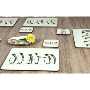 Yellow flower on table with Penguin Parade animal corkbacked tablemats and coasters