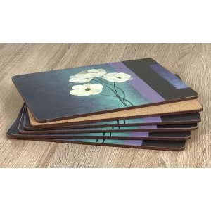 Stacked display of Plymouth Pottery Timeless white flowers set of 6 tablemats with cork base showing