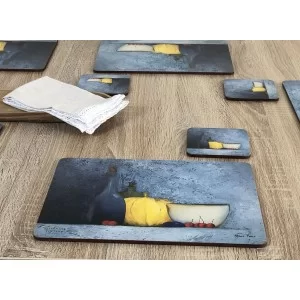 Blue Harmony fruit based set of 6 tablemats on wooden table with white napkin